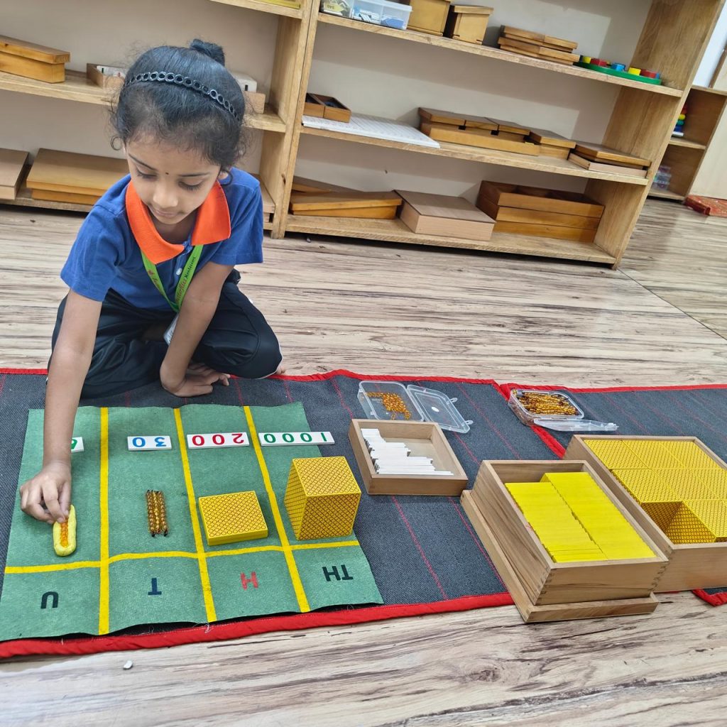 A child at Butterflies Montessori working with Montessori bead material